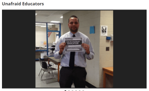 Teacher with Unafraid Educators sign