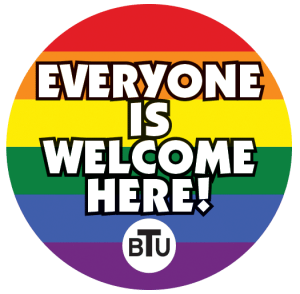 Rainbow circle with text "everyone is welcome here"
